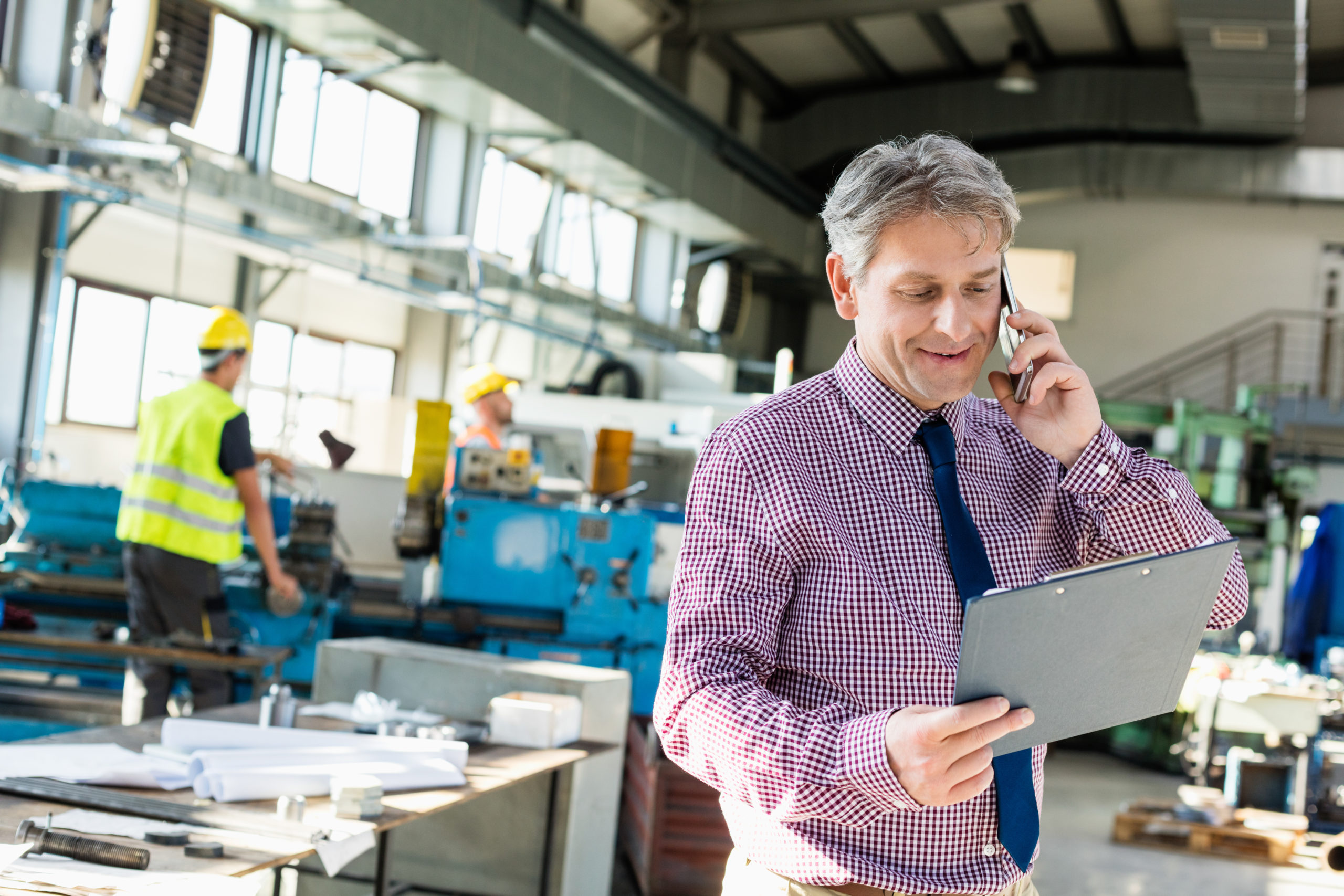 Manufacturing manager on phone